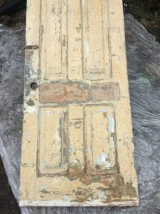 Old painted wood door after one round of paint remover